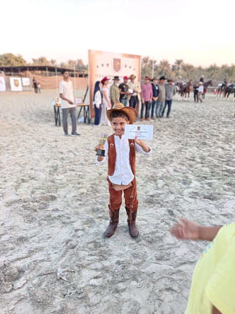 <p>A young rider with his trophy and citation.&nbsp;</p>